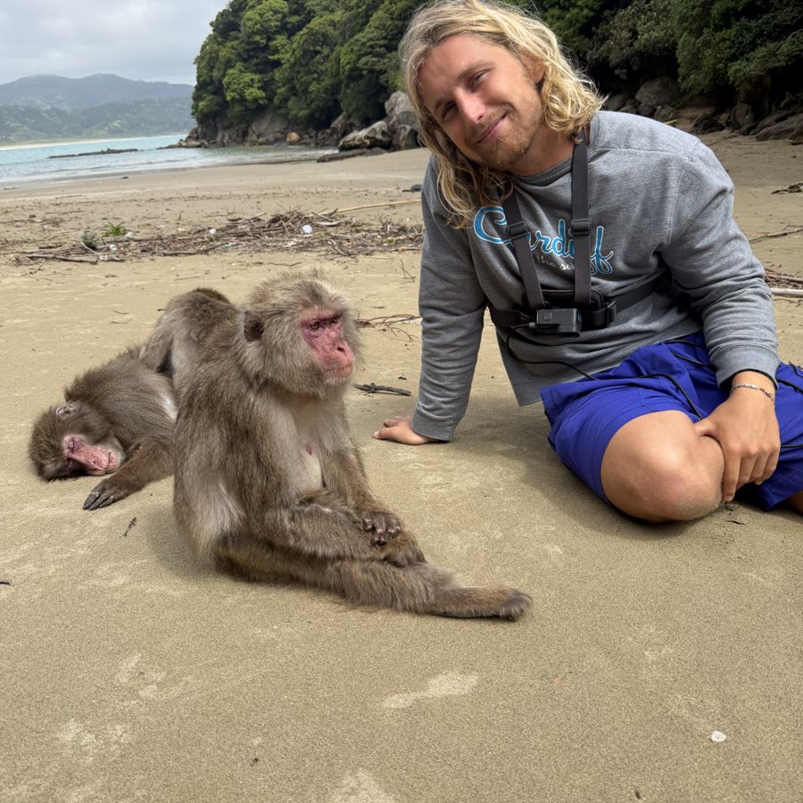 Evan on the beach with Japanese macaques, Koshima